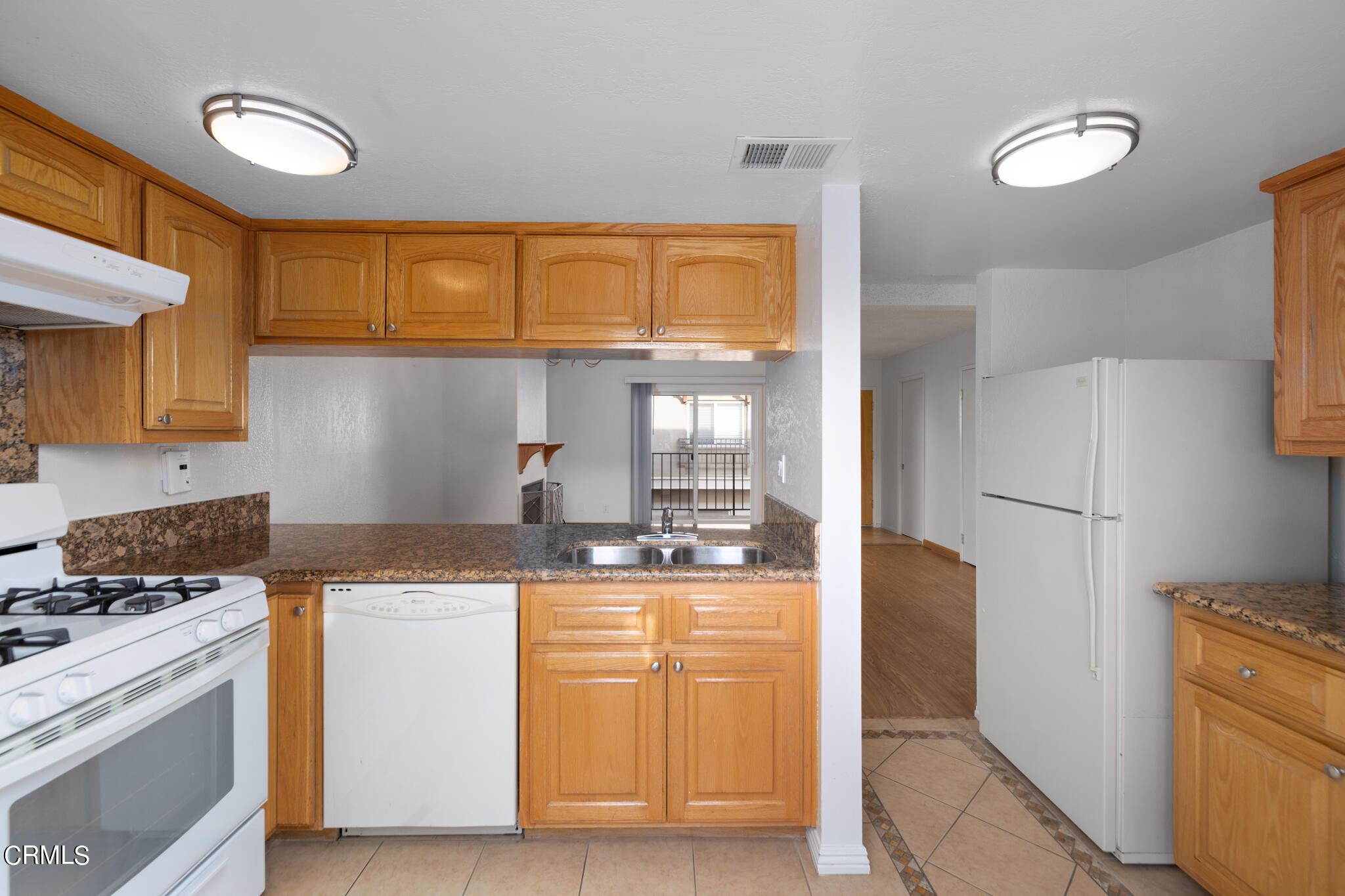 2429 Oswego Street, Unit B Pasadena, CA 91107 - Photo 12 of 25 a kitchen with stainless steel appliances granite countertop a stove a sink and a refrigerator