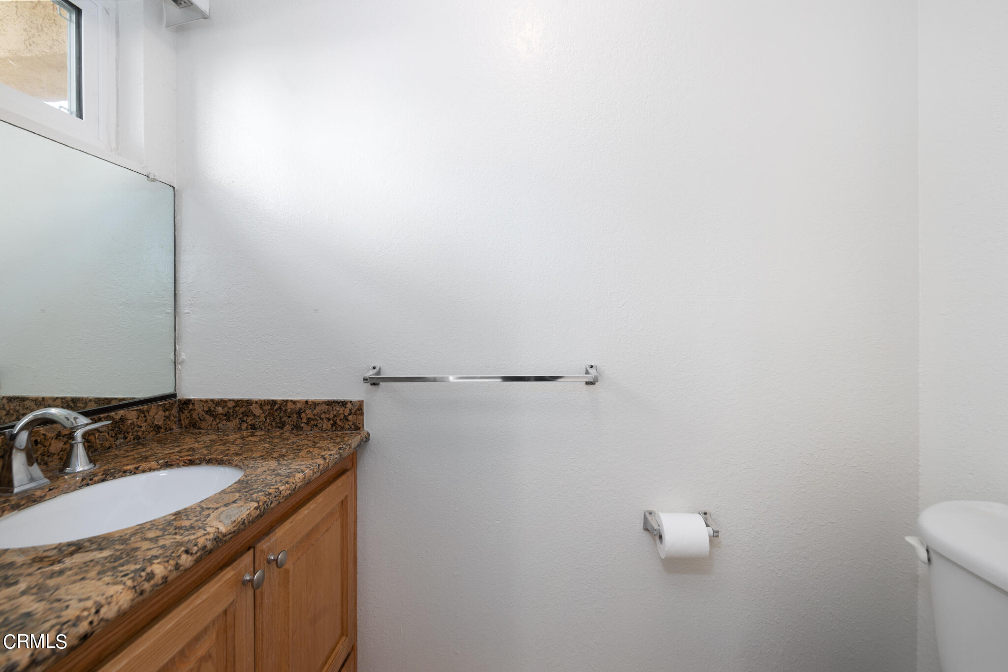 2429 Oswego Street, Unit B Pasadena, CA 91107 - Photo 13 of 25 a bathroom with a granite countertop sink and a toilet