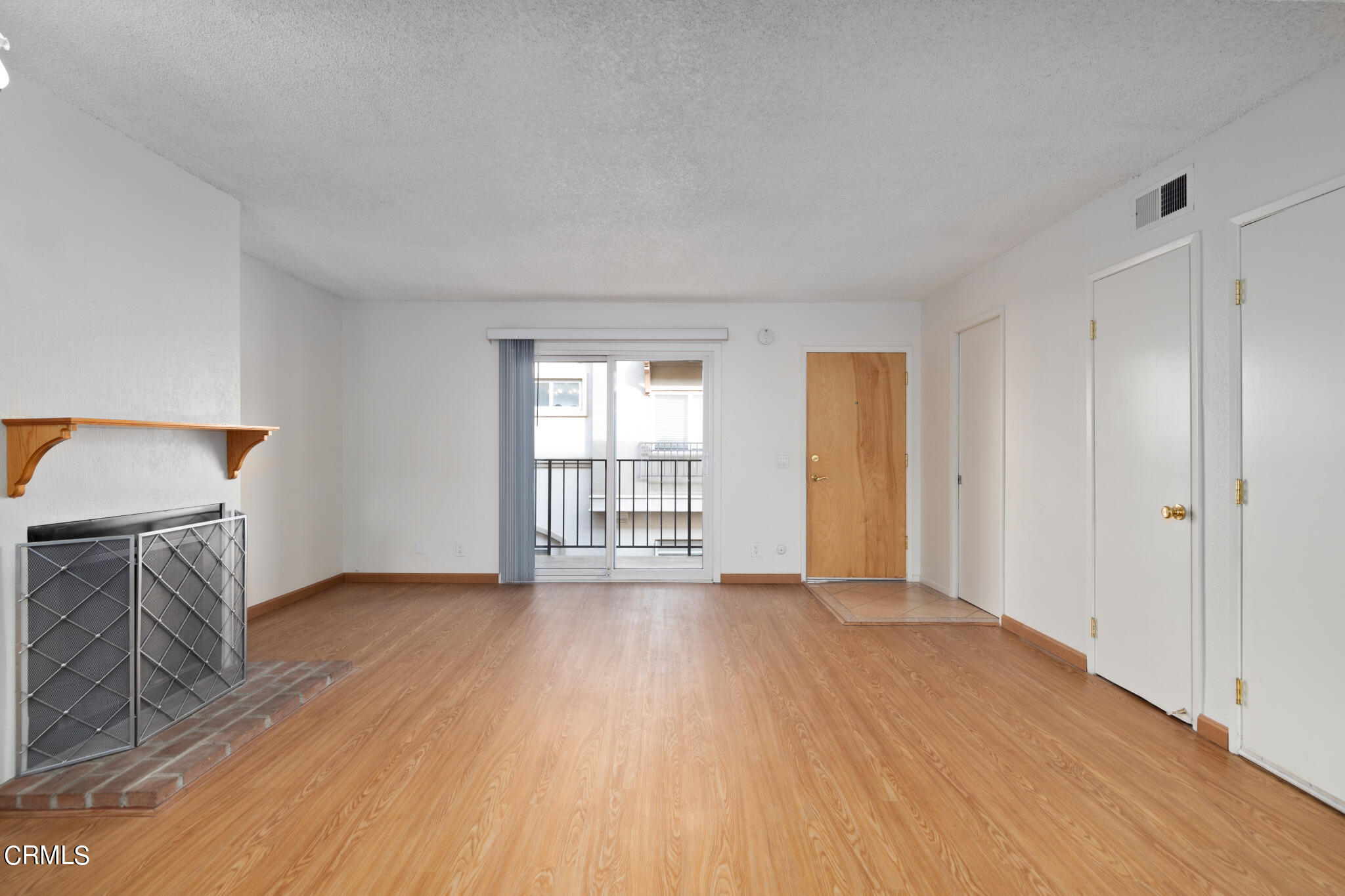 2429 Oswego Street, Unit B Pasadena, CA 91107 - Photo 8 of 25 a view of an empty room with wooden floor and a window