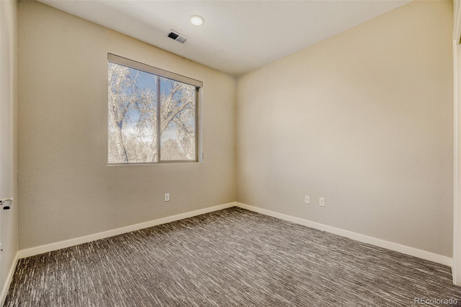 11691 West 45th Place Wheat Ridge, CO 80033 - Photo 18 of 30 wooden floor in an empty room with a window