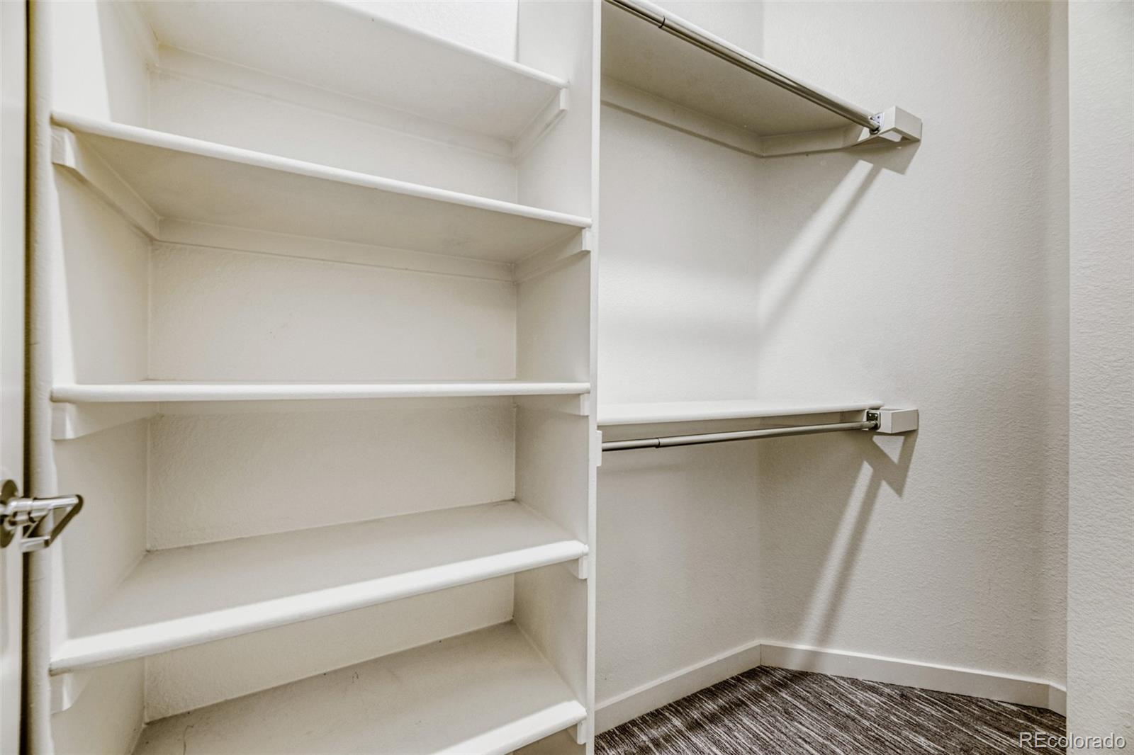 11691 West 45th Place Wheat Ridge, CO 80033 - Photo 19 of 30 a view of walk in closet with empty racks