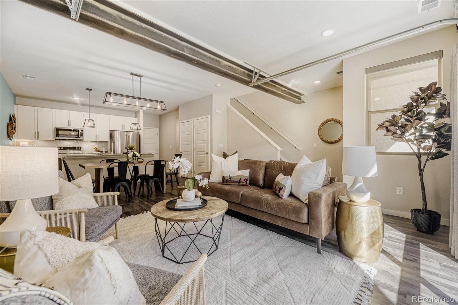 11691 West 45th Place Wheat Ridge, CO 80033 - Photo 4 of 30 a living room with furniture and a chandelier