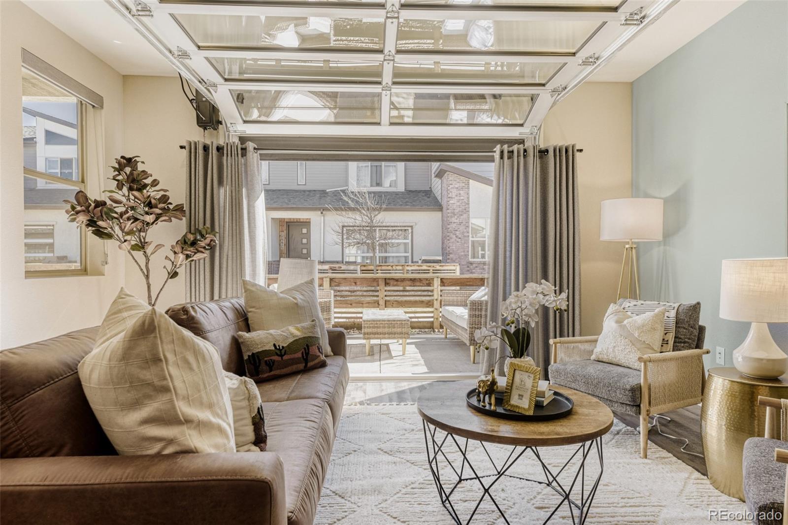 11691 West 45th Place Wheat Ridge, CO 80033 - Photo 5 of 30 a living room with furniture and a potted plant
