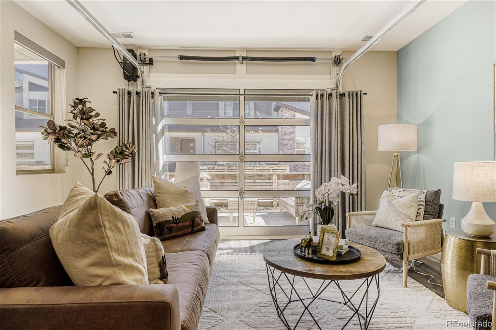 11691 West 45th Place Wheat Ridge, CO 80033 - Photo 6 of 30 a living room with furniture and a potted plant