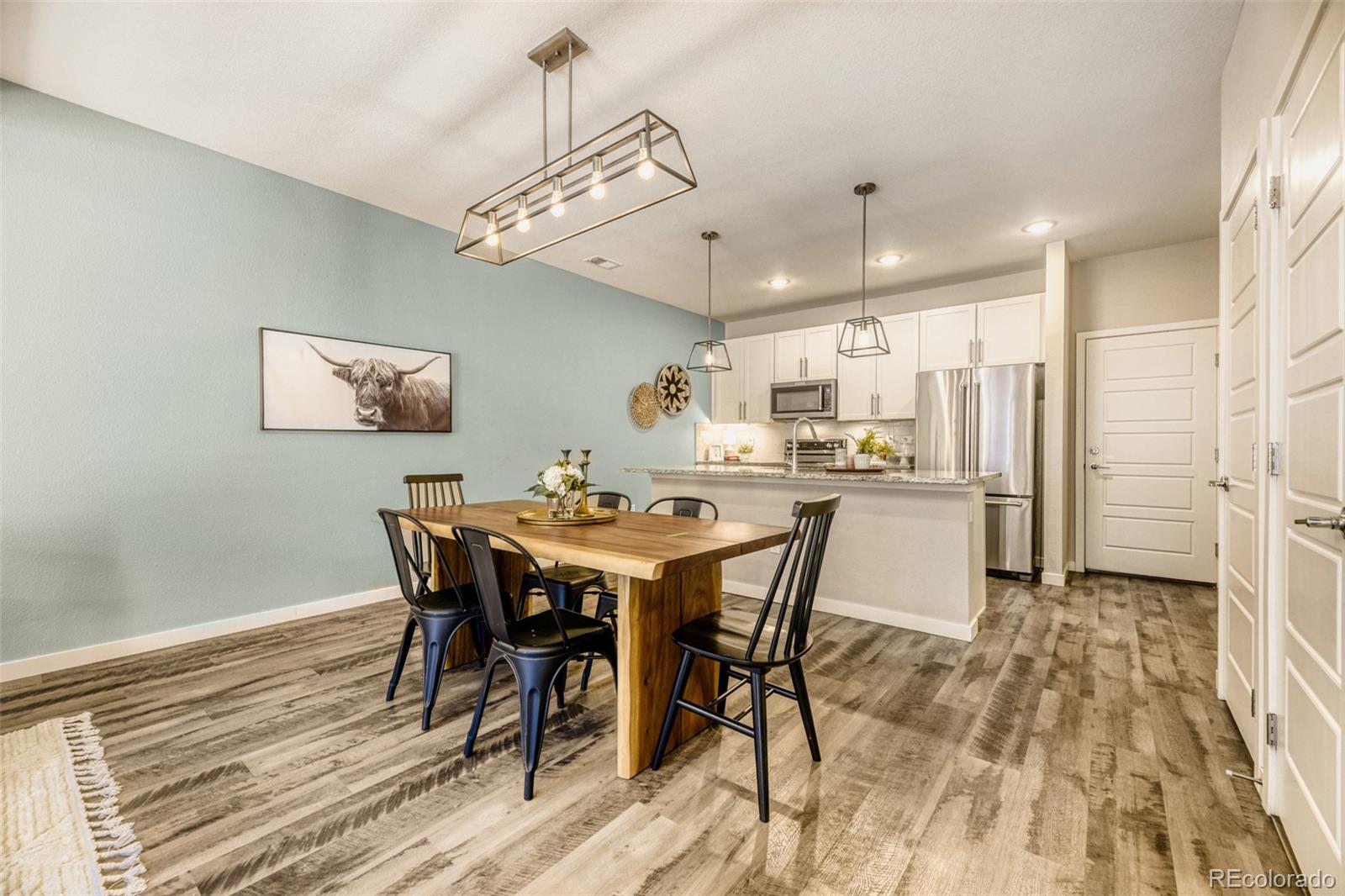 11691 West 45th Place Wheat Ridge, CO 80033 - Photo 9 of 30 a view of a dining room with furniture
