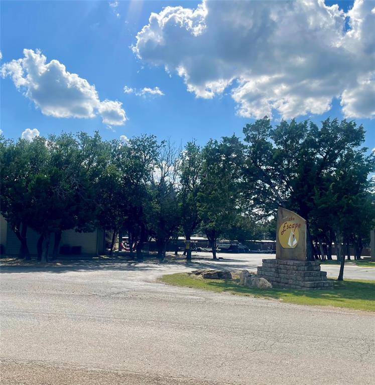 3059 Hells Gate Loop, Unit 2 Strawn, TX 76475 - Photo 2 of 39 Parking lot entry closest to unit #2
