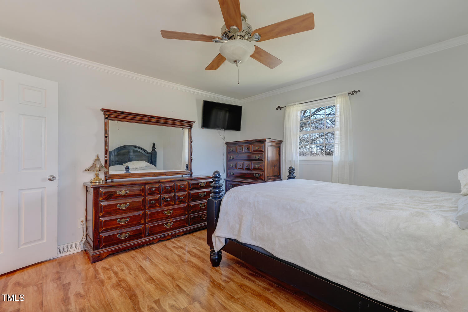 650 Huffines Mill Road Reidsville, NC 27320 - Photo 20 of 35 a bedroom with a bed and a dresser with the outer view