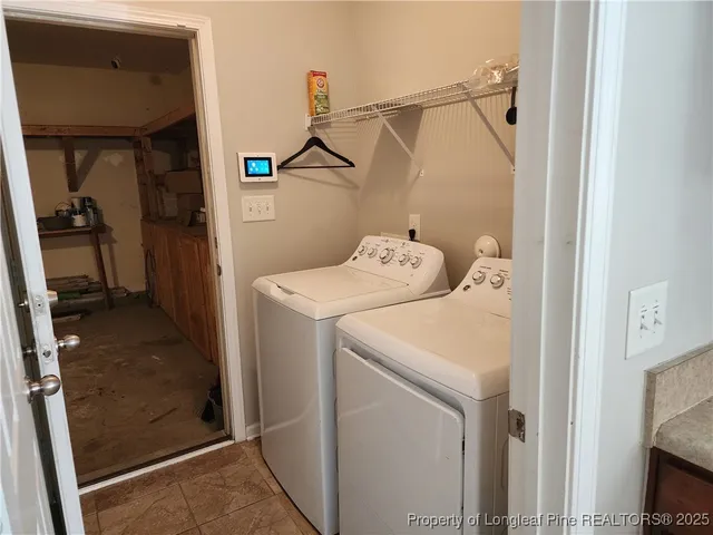 a white toilet sitting next to a white wall