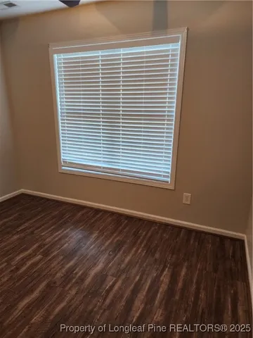 a view of a livingroom with wooden floor