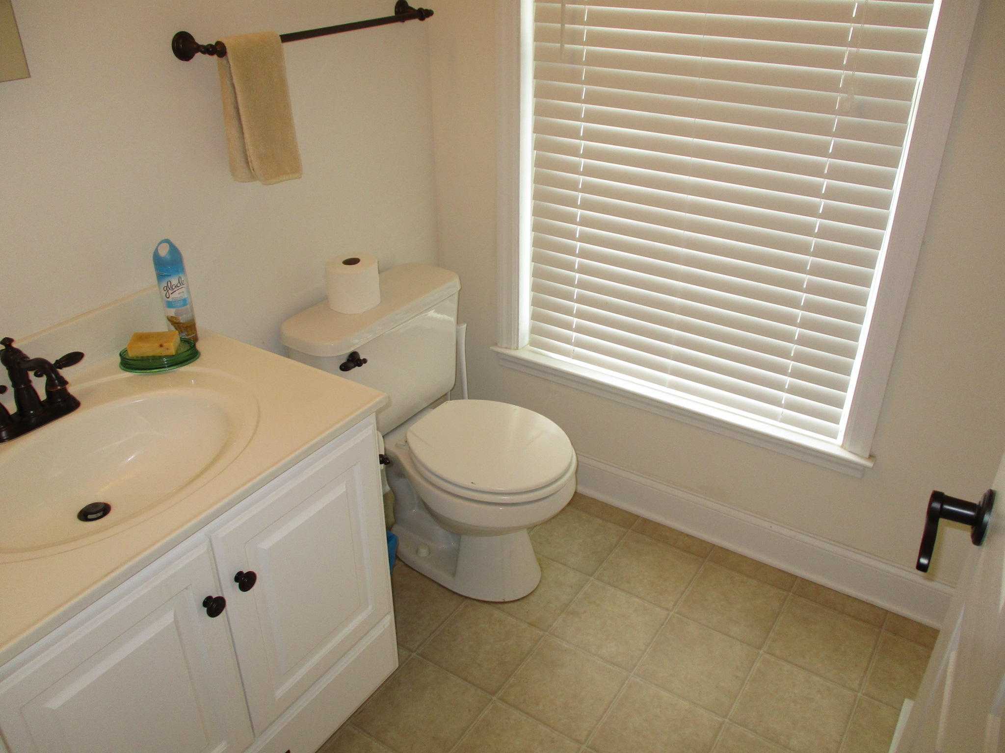 115 Marcom Drive Northwest Riner, VA 24149 - Photo 12 of 31 a bathroom with a sink a toilet and a window