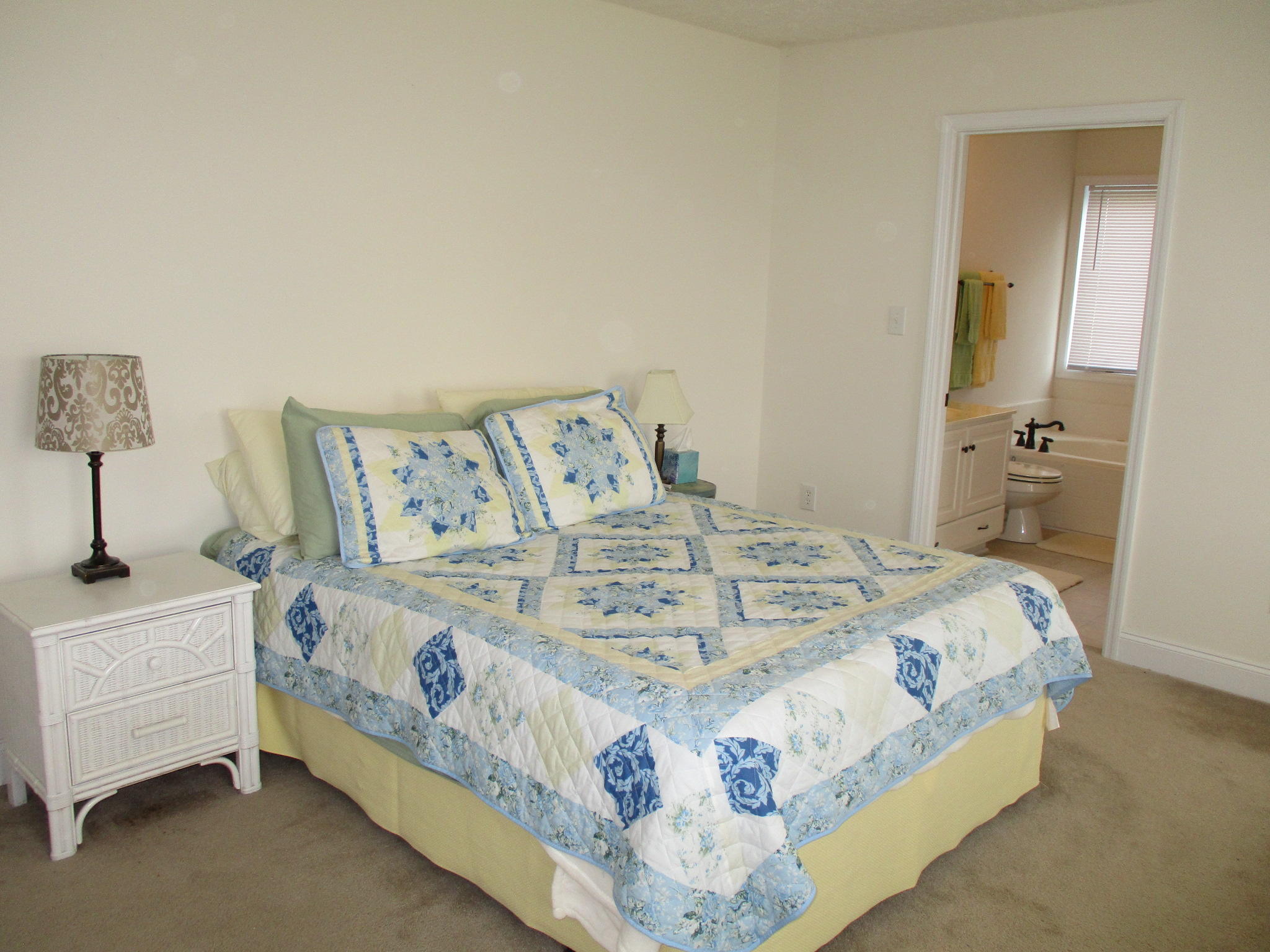 115 Marcom Drive Northwest Riner, VA 24149 - Photo 14 of 31 a bedroom with a bed and a lamp on table
