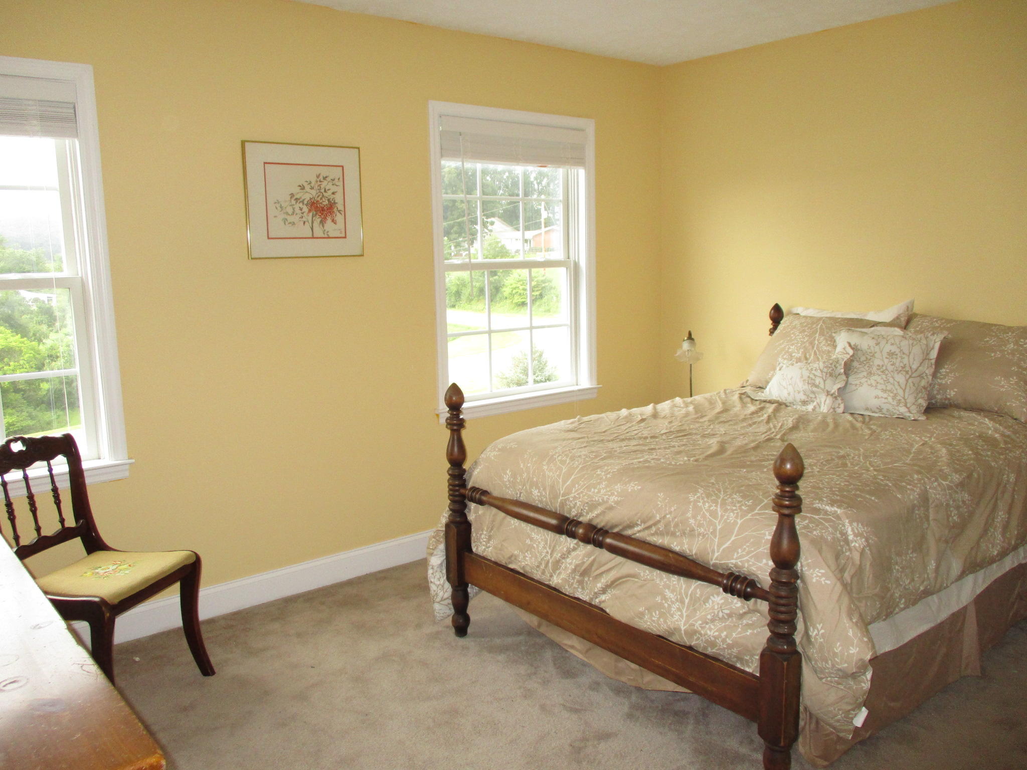 115 Marcom Drive Northwest Riner, VA 24149 - Photo 21 of 31 a bed sitting in a bedroom next to a window