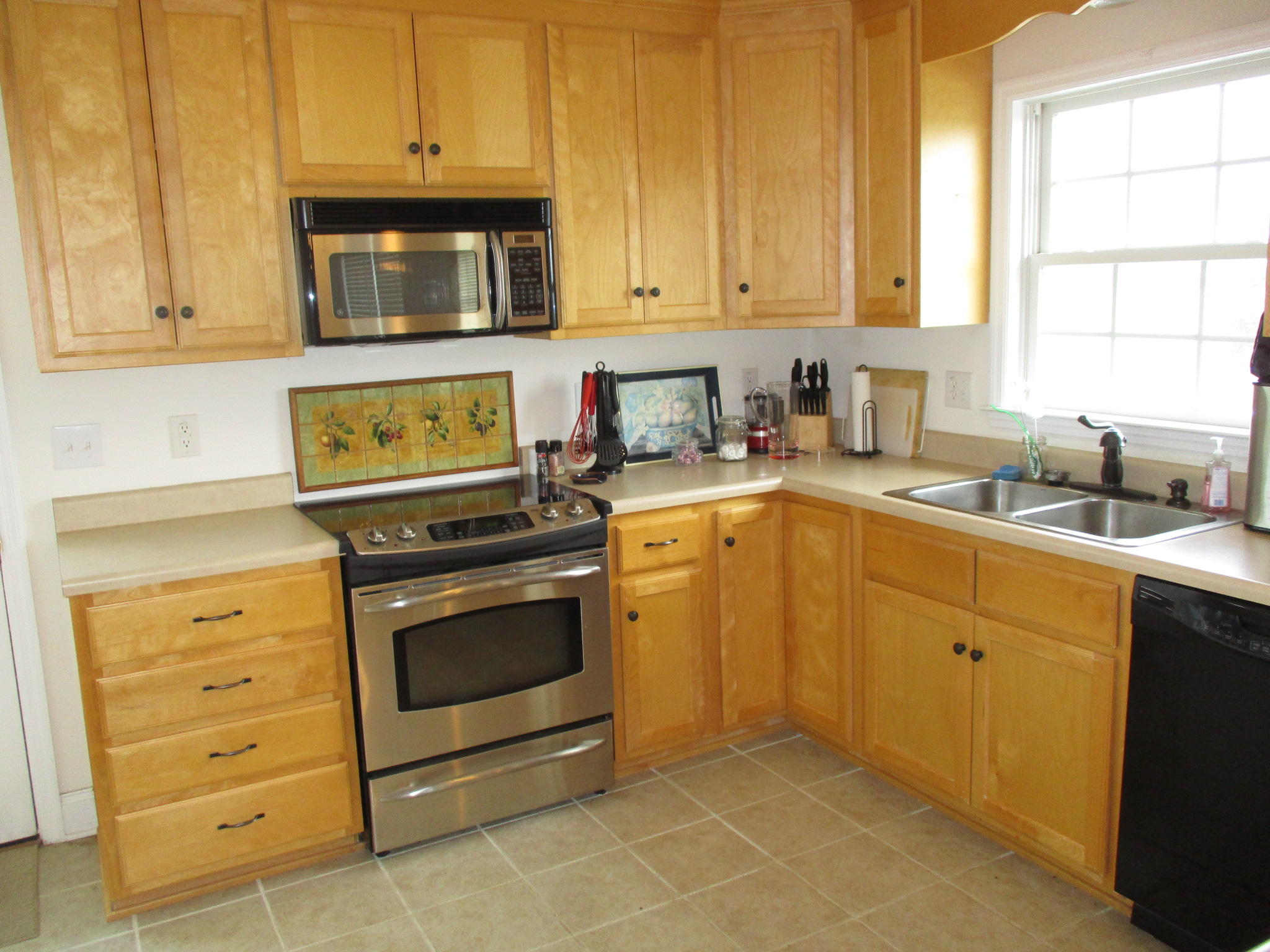 115 Marcom Drive Northwest Riner, VA 24149 - Photo 7 of 31 a kitchen with granite countertop a sink cabinets stainless steel appliances and a window