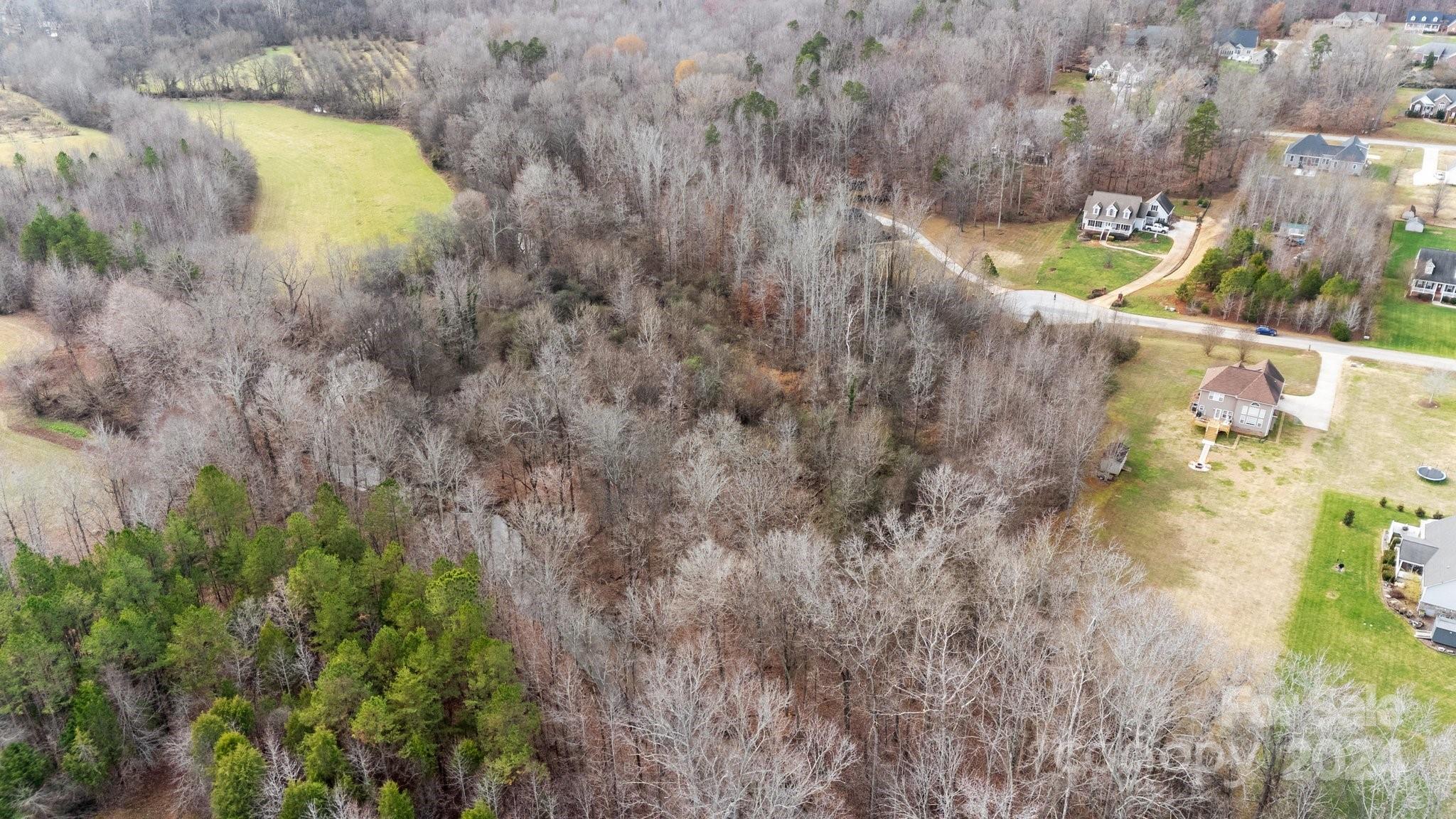 609 Copperfield Lane Lexington, NC 27292 - Photo 15 of 18 a aerial view of a house with swimming pool and large trees