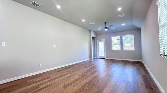 a kitchen with stainless steel appliances a refrigerator sink and microwave