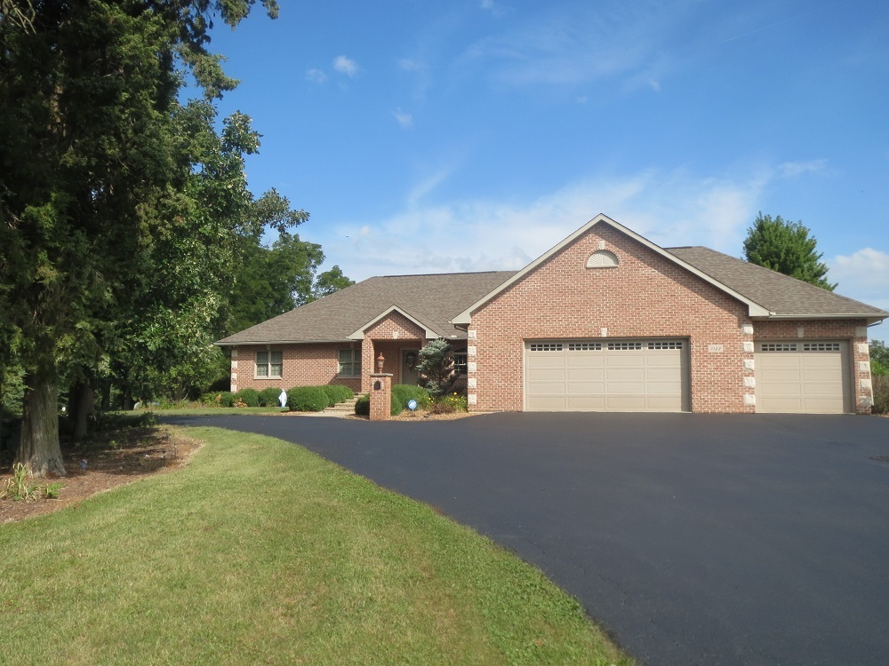 1122 Sterling Road Dixon, IL 61021 - Photo 1 of 45 a front view of a house with yard