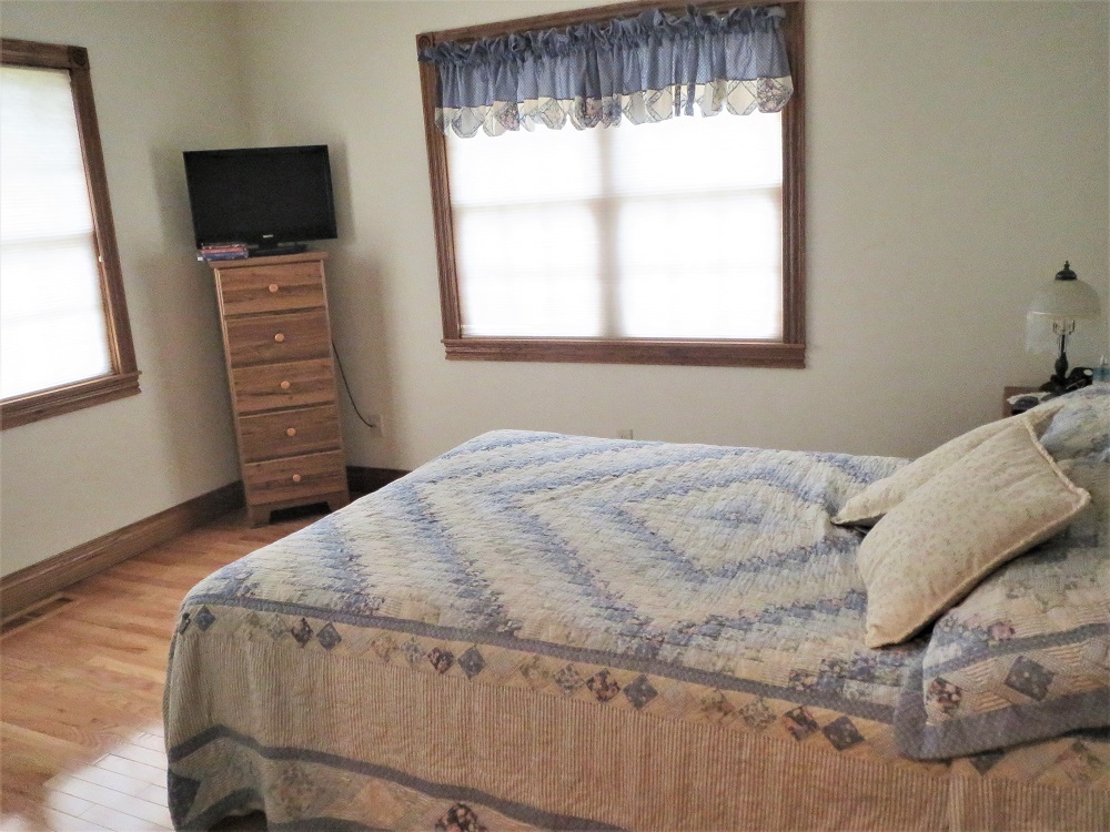 1122 Sterling Road Dixon, IL 61021 - Photo 15 of 45 a bedroom with a bed and flat tv screen