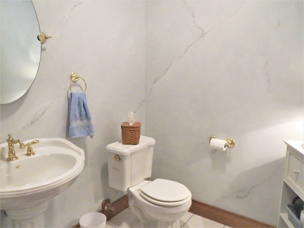 1122 Sterling Road Dixon, IL 61021 - Photo 18 of 45 a bathroom with a sink a toilet and a mirror
