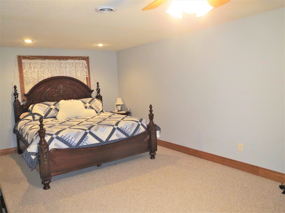1122 Sterling Road Dixon, IL 61021 - Photo 27 of 45 a bedroom with a bed and a mirror
