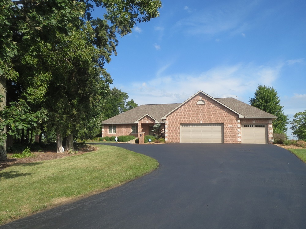 1122 Sterling Road Dixon, IL 61021 - Photo 44 of 45 a view of a house with a big yard and large trees
