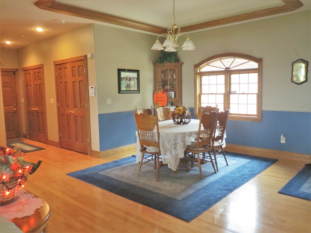 1122 Sterling Road Dixon, IL 61021 - Photo 8 of 45 a view of a dining room with furniture window and wooden floor