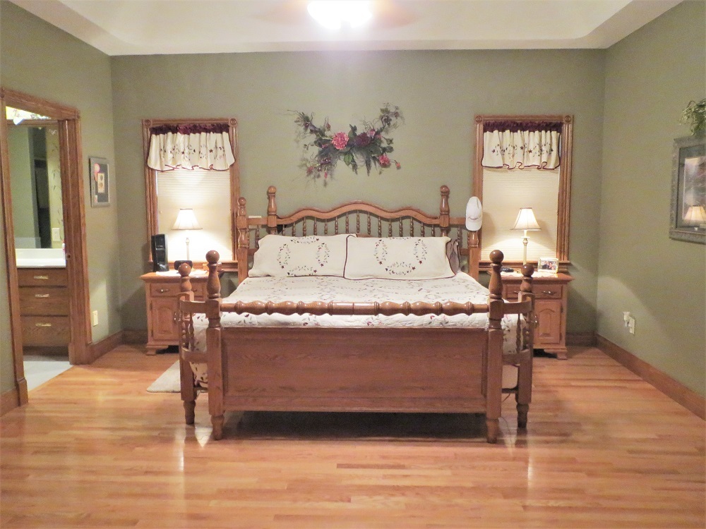1122 Sterling Road Dixon, IL 61021 - Photo 9 of 45 a bed sitting in a bedroom next to a window
