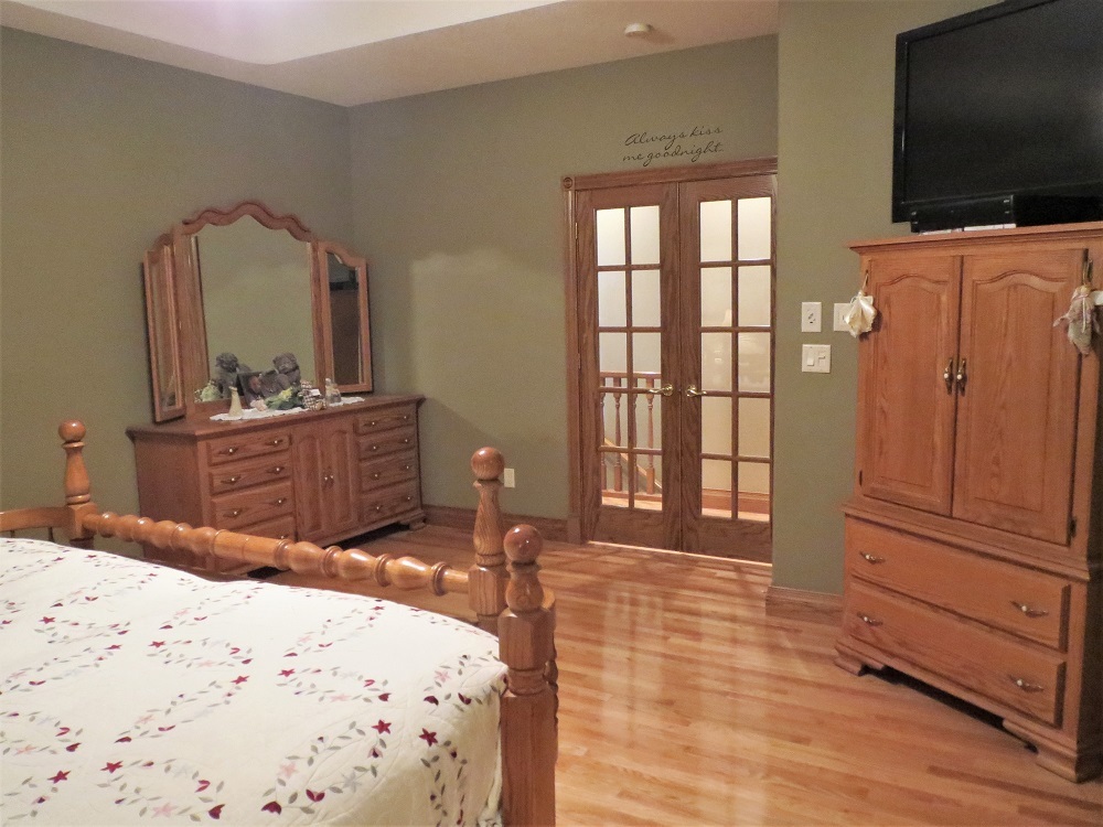 1122 Sterling Road Dixon, IL 61021 - Photo 10 of 45 a bedroom with a bed and a flat screen tv