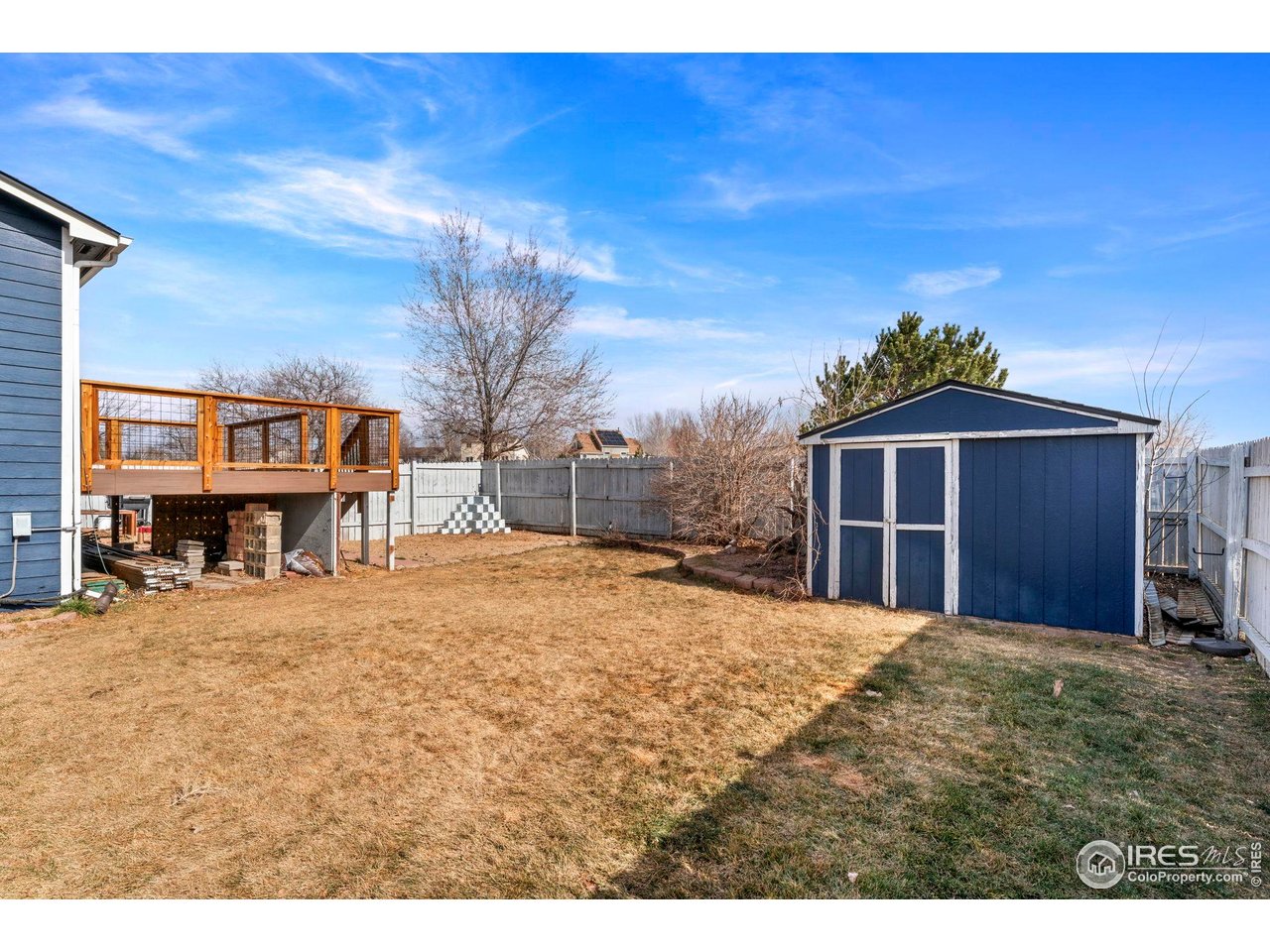 124 Adams Way Firestone, CO 80520 - Photo 25 of 34 a view of a house with a yard