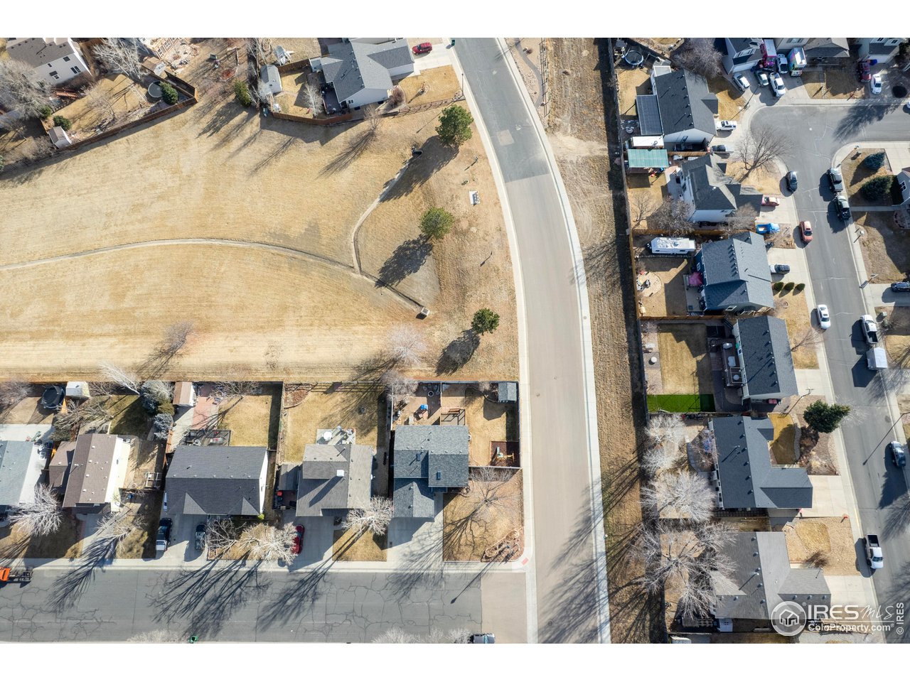 124 Adams Way Firestone, CO 80520 - Photo 34 of 34 an aerial view of residential houses with outdoor space