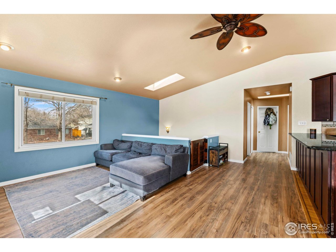 124 Adams Way Firestone, CO 80520 - Photo 5 of 34 a bedroom with furniture and a wooden floor