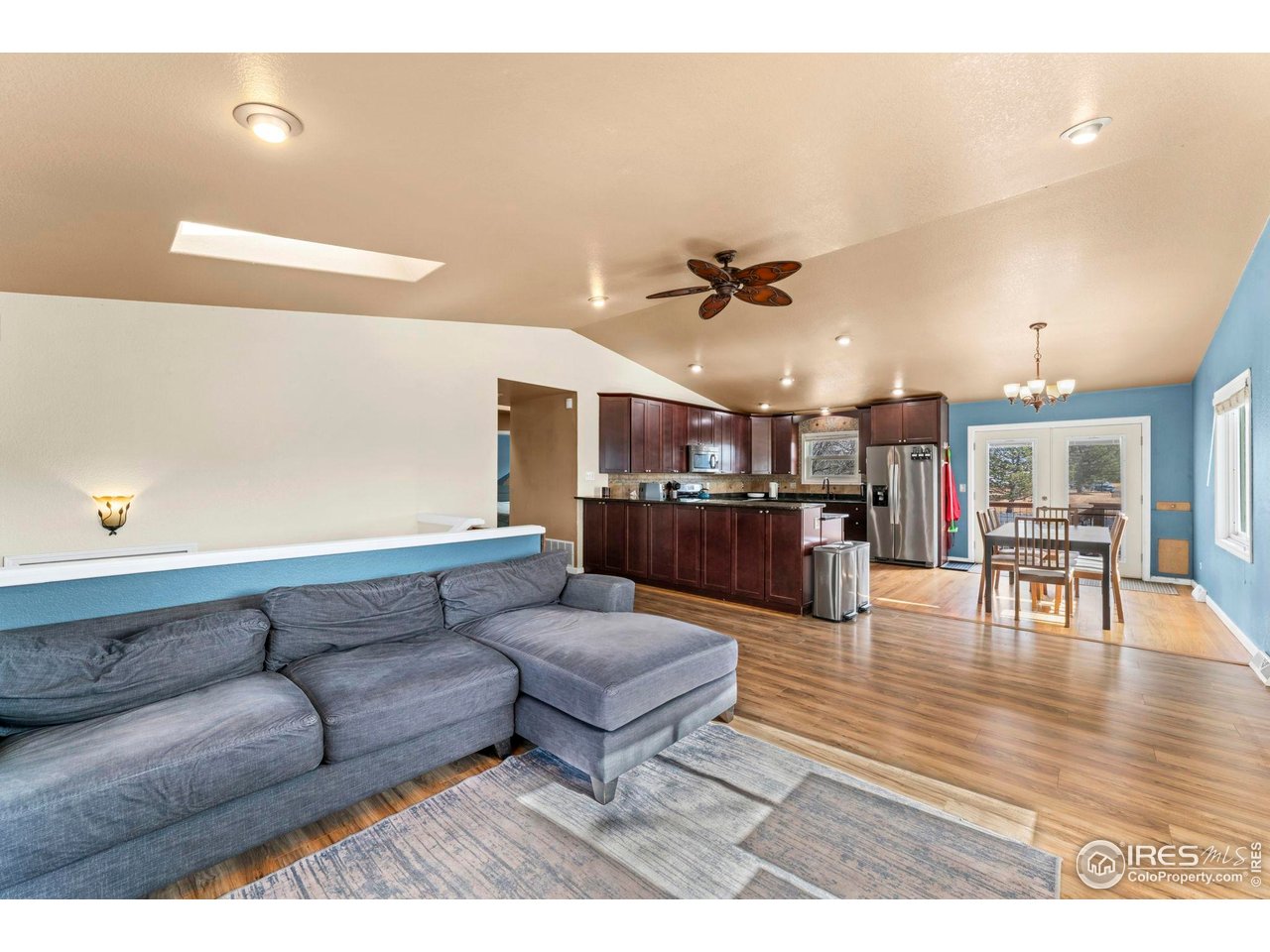 124 Adams Way Firestone, CO 80520 - Photo 7 of 34 a living room with furniture and kitchen view
