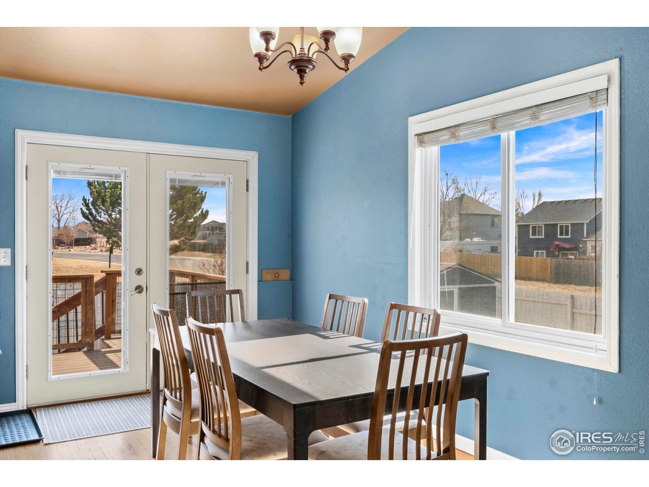 124 Adams Way Firestone, CO 80520 - Photo 9 of 34 a view of a dining room with furniture window and wooden floor