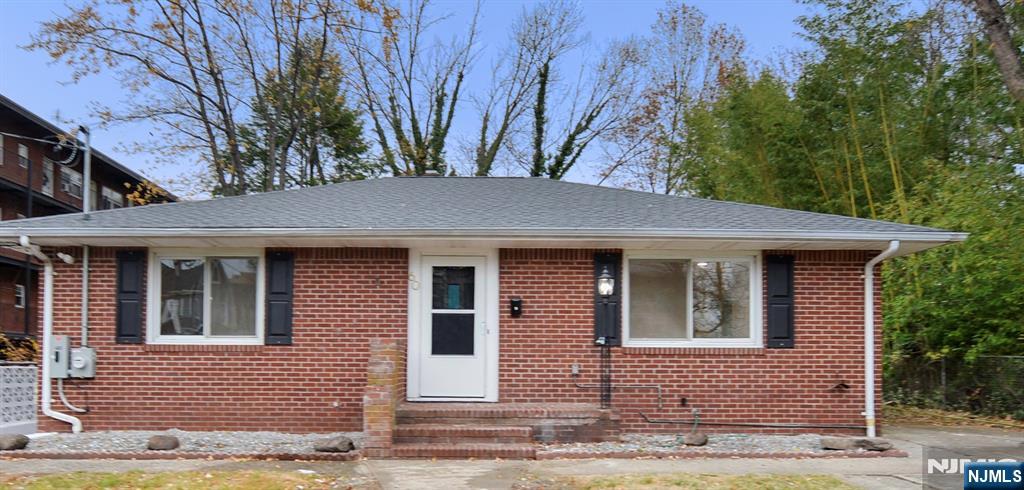 60 Poplar Avenue Hackensack, NJ 07601 - Photo 1 of 1 a front view of a house with a yard
