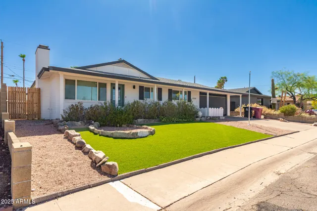 a view of a house with swimming pool and porch