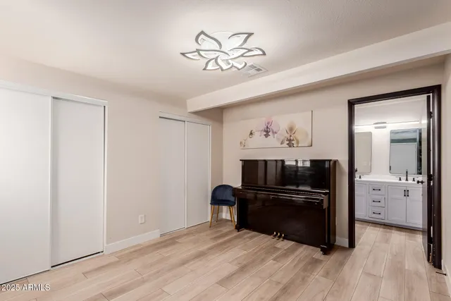 a view of kitchen with a refrigerator and a stove top oven