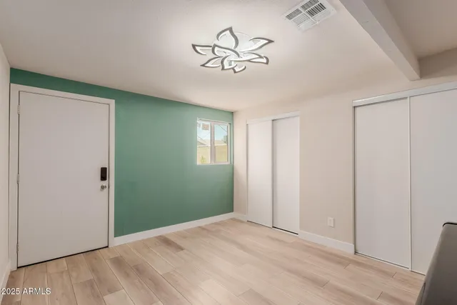 a view of empty room with ceiling fan