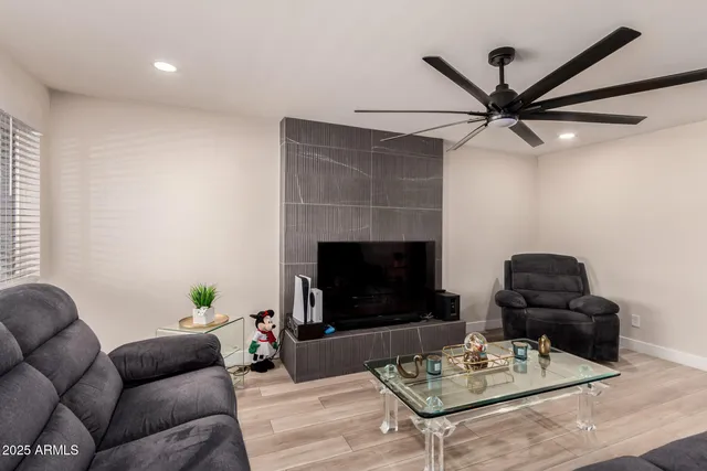 a living room with furniture and a fireplace