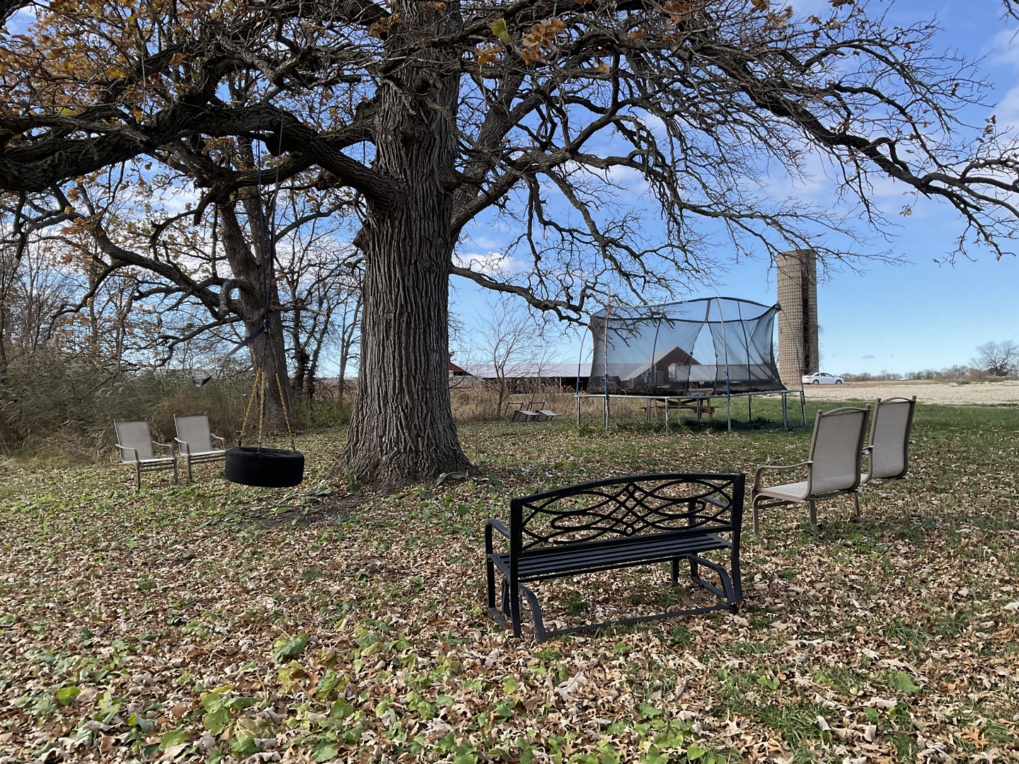 6010-6060 East Minooka Road Minooka, IL 60447 - Photo 16 of 24 a bench sitting in middle of a yard