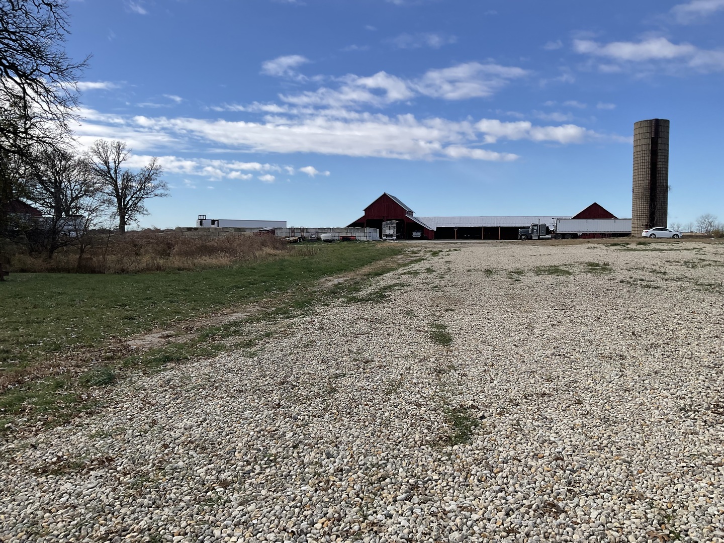 6010-6060 East Minooka Road Minooka, IL 60447 - Photo 17 of 24 a view of a lake with a big yard