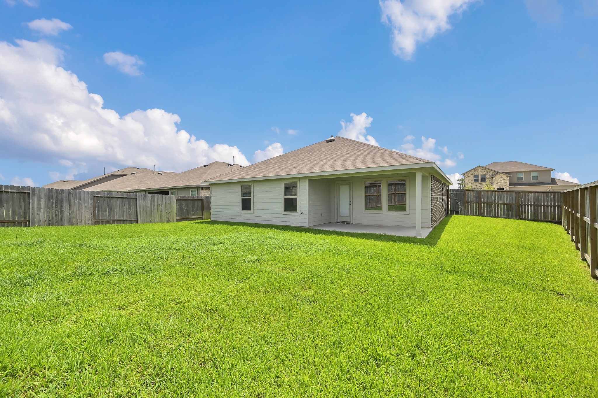 21391 Owl Road New Caney, TX 77357 - Photo 12 of 13 a front view of a house with a garden