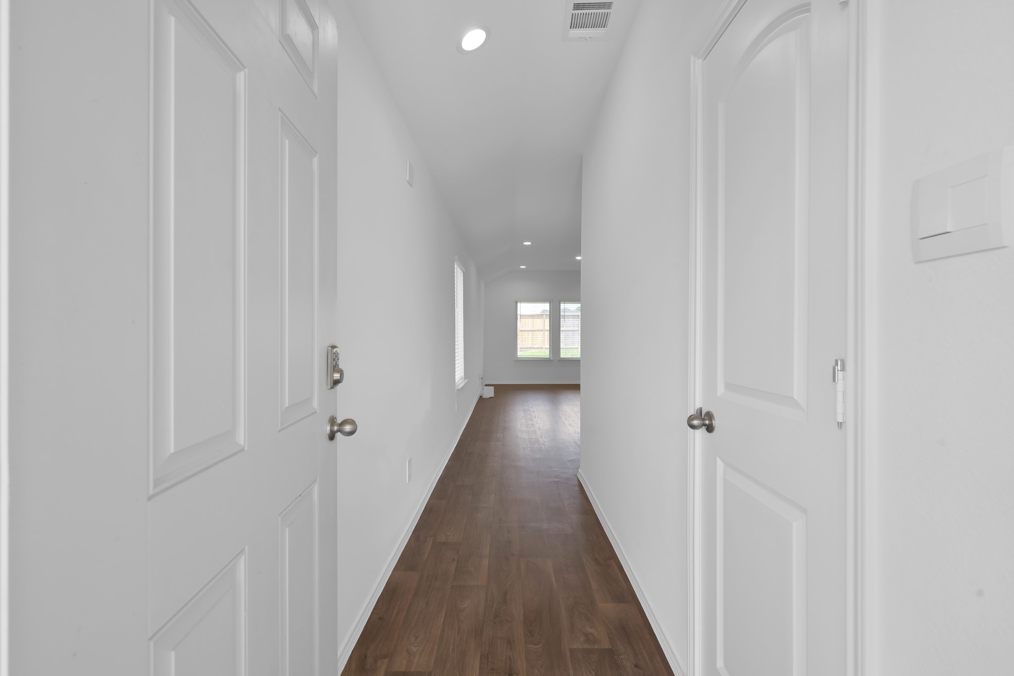21391 Owl Road New Caney, TX 77357 - Photo 2 of 13 a view of a hallway with wooden floor and a shower