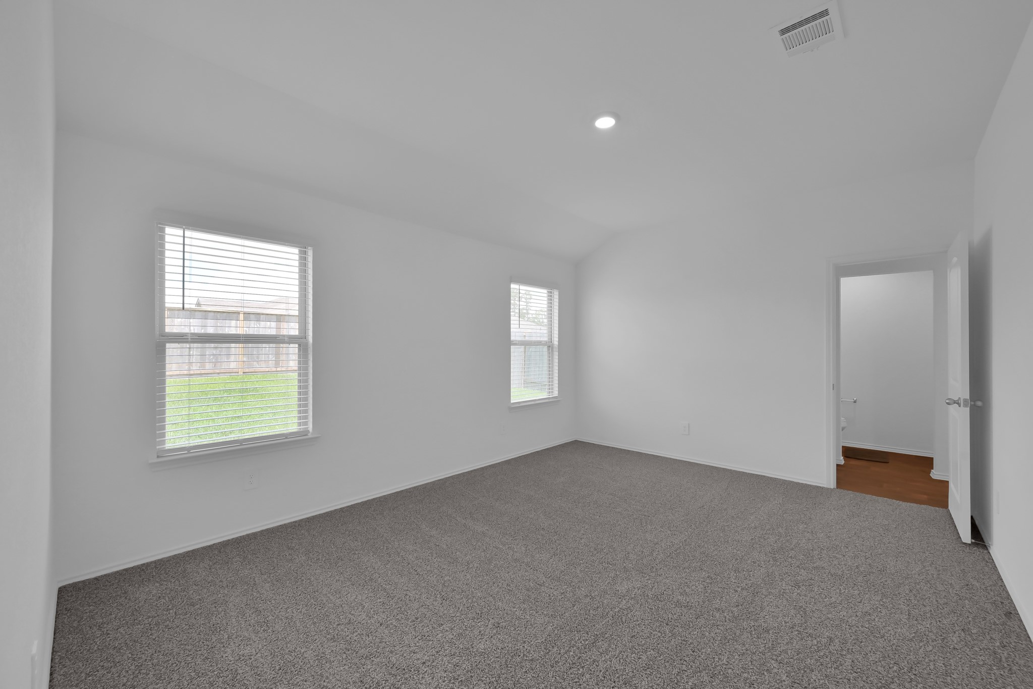 21391 Owl Road New Caney, TX 77357 - Photo 5 of 13 an empty room with windows