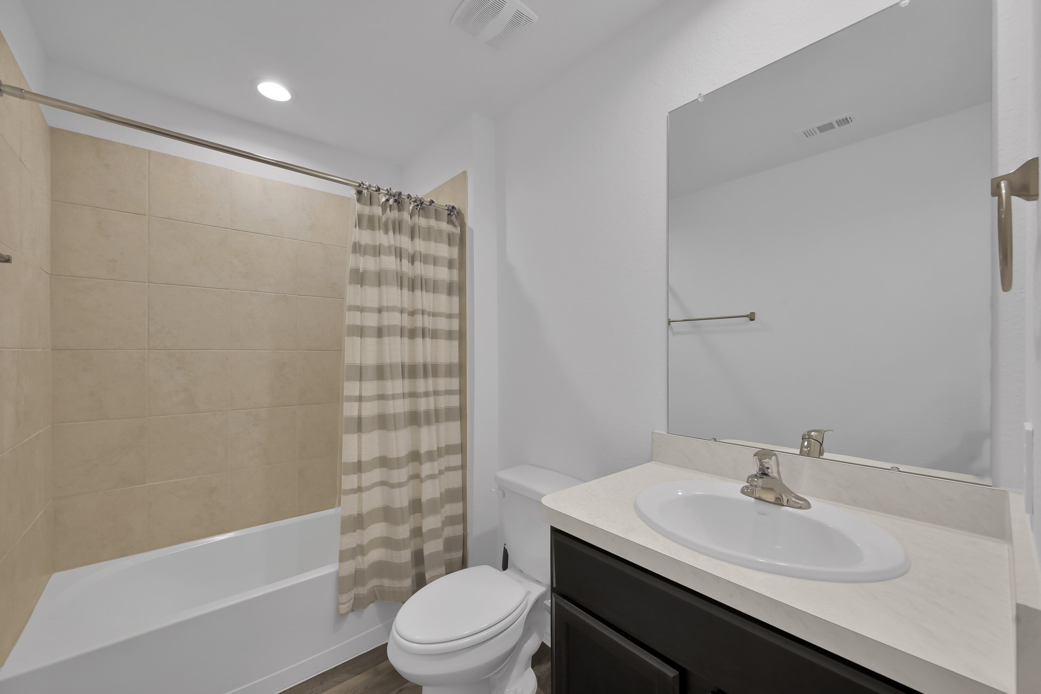 21391 Owl Road New Caney, TX 77357 - Photo 10 of 13 a bathroom with a sink a toilet and shower