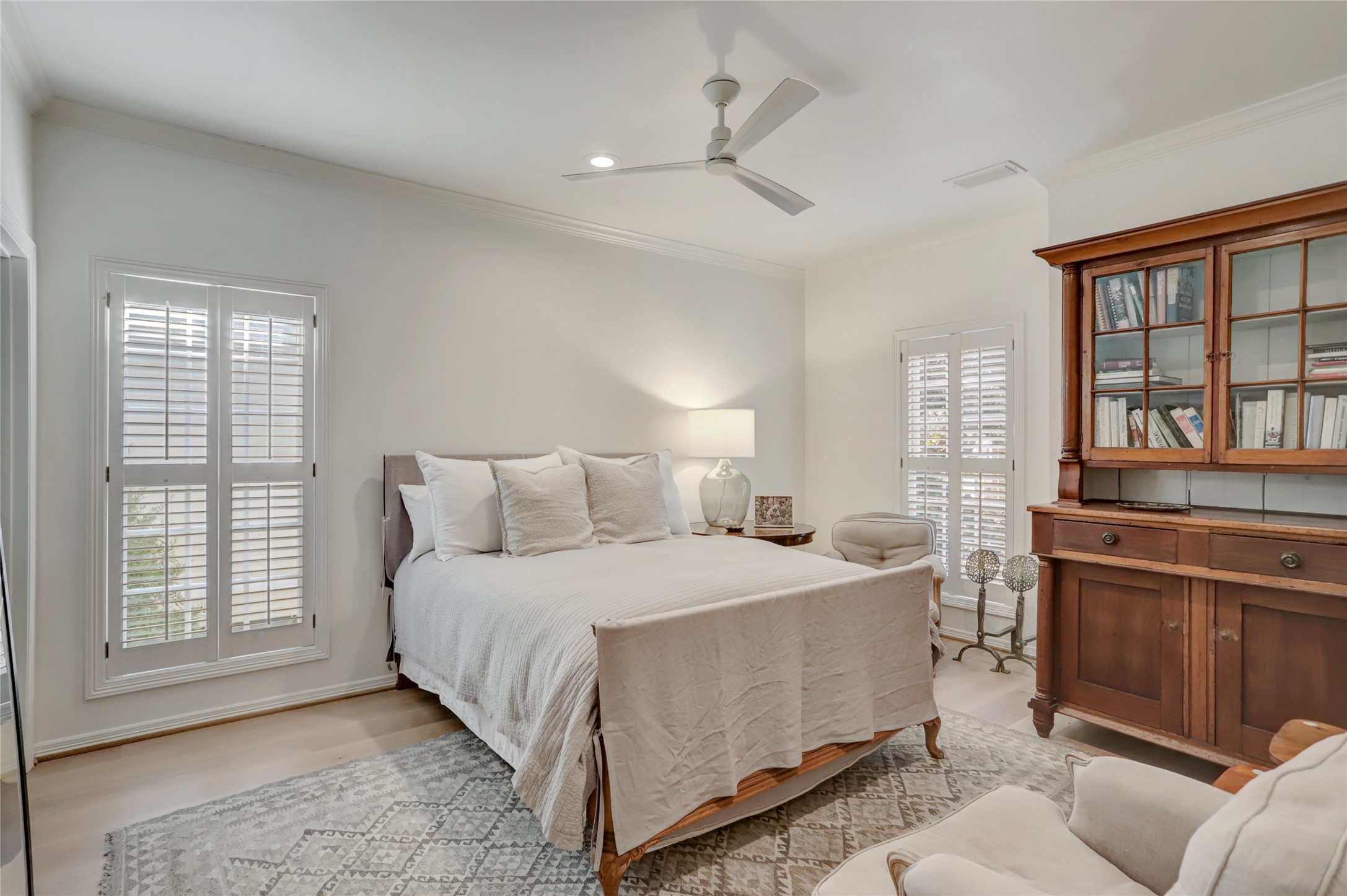 2703 Mid Lane, Unit 4 Houston, TX 77027 - Photo 13 of 16 a bedroom with a bed and wooden floor