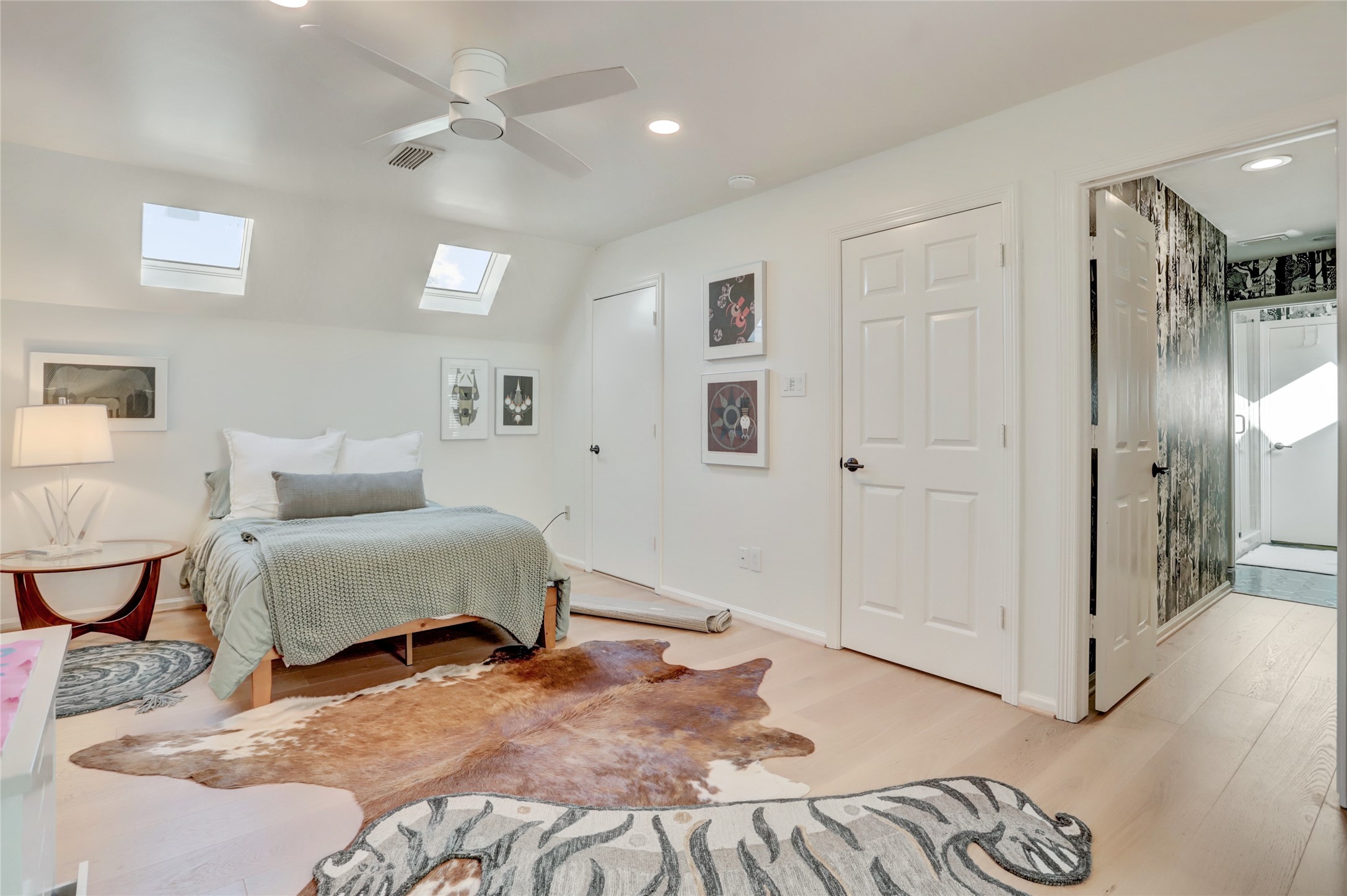 2703 Mid Lane, Unit 4 Houston, TX 77027 - Photo 15 of 16 a bedroom with a bed and a chandelier