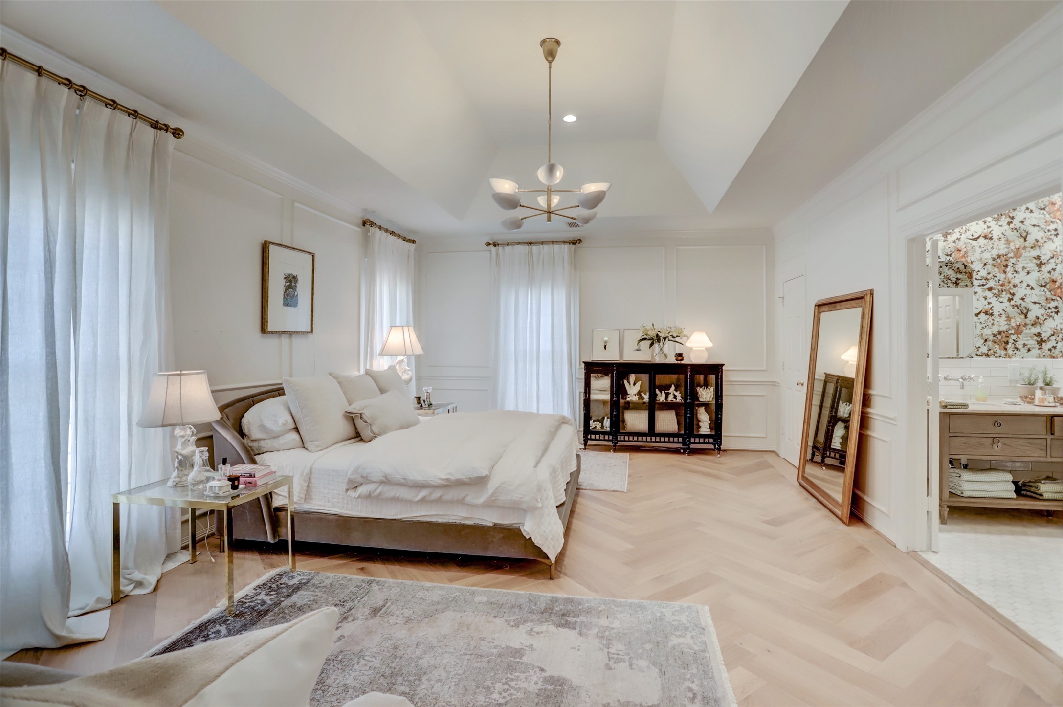 2703 Mid Lane, Unit 4 Houston, TX 77027 - Photo 9 of 16 a bedroom with furniture and a chandelier