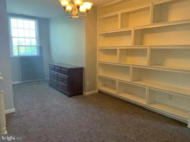 a room with a furniture and natural light