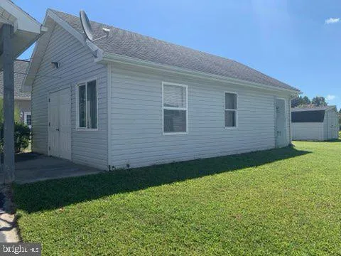 a view of a backyard of the house