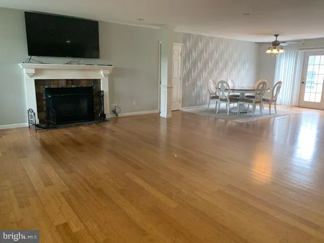 a view of a livingroom with furniture and a fireplace
