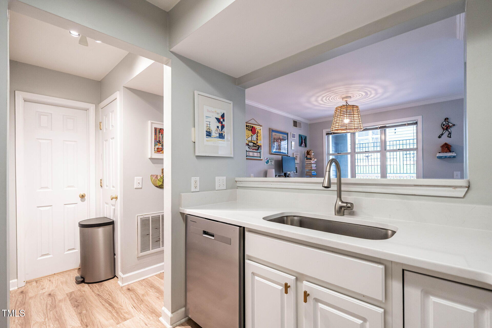 1111 Parkridge Lane, Unit 103 Raleigh, NC 27605 - Photo 15 of 24 a kitchen with a sink and a refrigerator